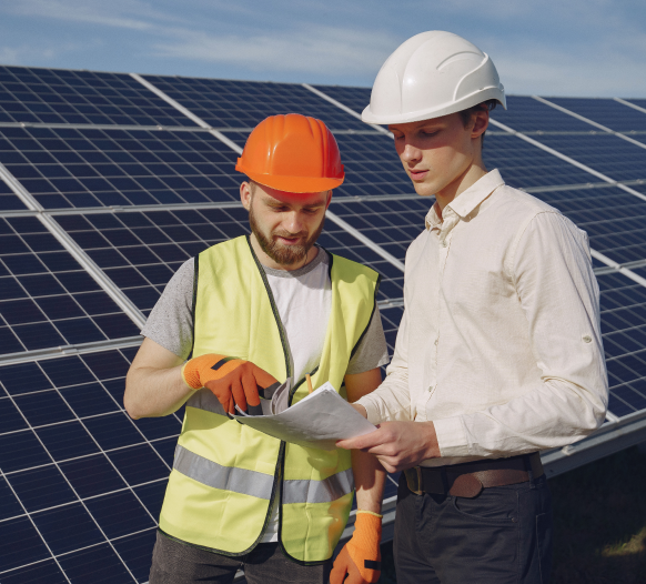 Engineer and client discussing a solar proposal onsite